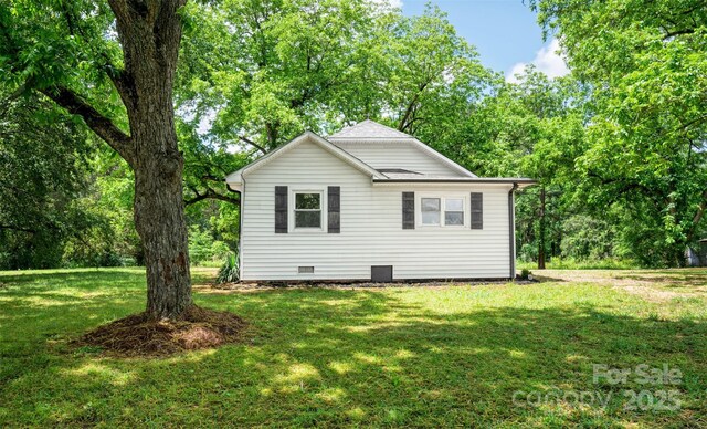 615 Irish Potato Rd, Concord, NC 28025 - view of side of home with crawl space and a lawn