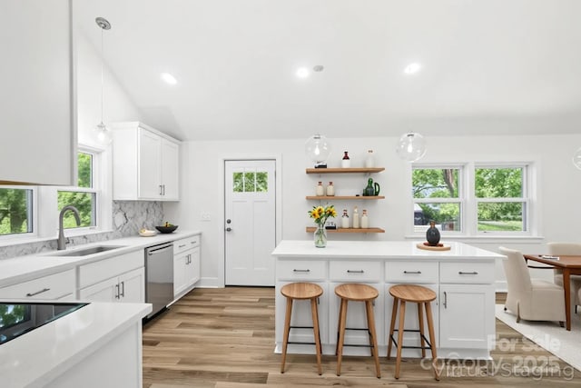615 Irish Potato Rd, Concord, NC 28025 - kitchen with stainless steel dishwasher, a sink, plenty of natural light, and recessed lighting