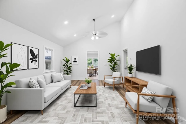 615 Irish Potato Rd, Concord, NC 28025 - living room featuring a ceiling fan, recessed lighting, light wood-style floors, high vaulted ceiling, and baseboards