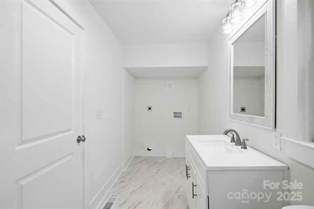 615 Irish Potato Rd, Concord, NC 28025 - half bath with marble look tile flooring, vanity, and baseboards