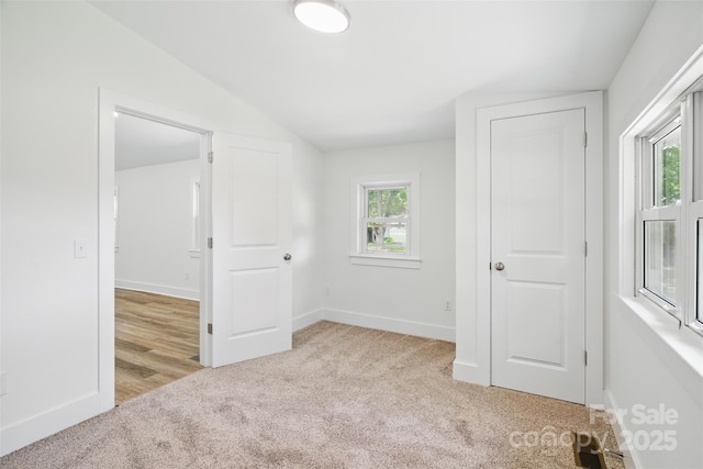 615 Irish Potato Rd, Concord, NC 28025 - carpeted spare room with plenty of natural light, baseboards, and lofted ceiling