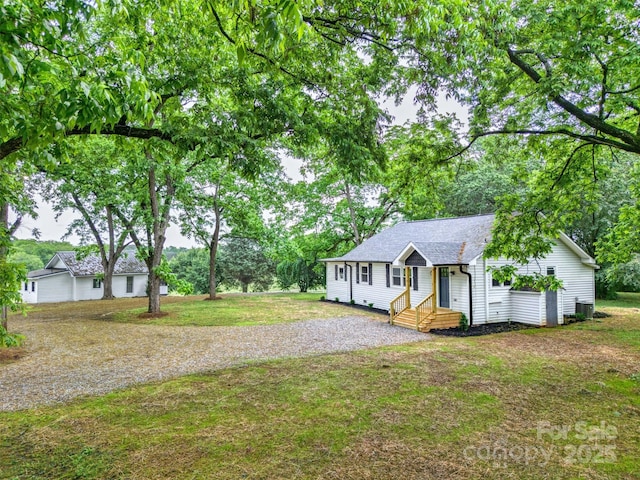 615 Irish Potato Rd, Concord, NC 28025 - view of front of home featuring cooling unit, a front lawn, and driveway