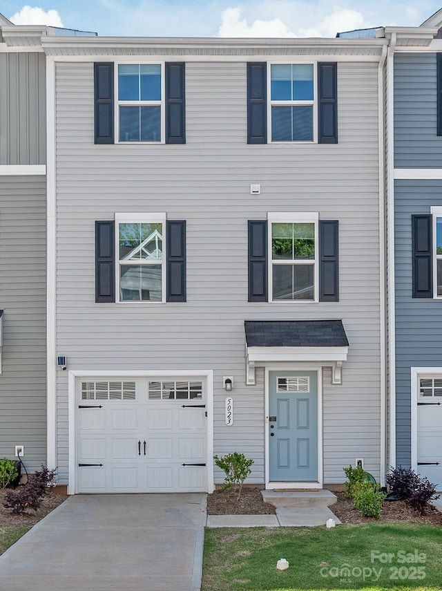 5023 Daybell St, Charlotte, NC 28214 - view of front of property featuring an attached garage and driveway