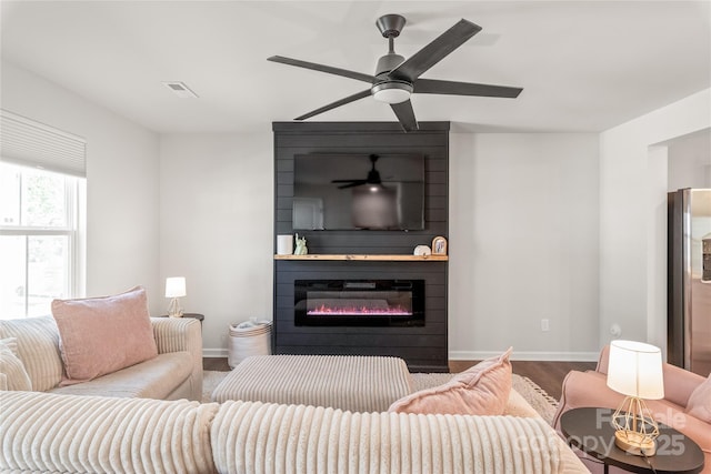 5023 Daybell St, Charlotte, NC 28214 - living area with ceiling fan, baseboards, a large fireplace, and wood finished floors