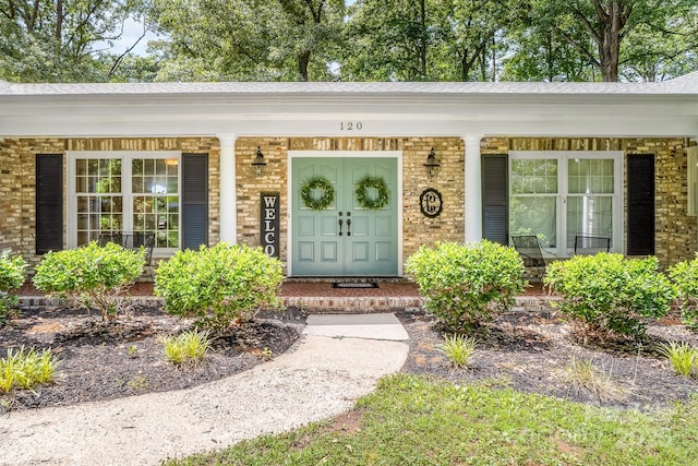 120 Labans Ln, Lincolnton, NC 28092 - view of exterior entry with covered porch and brick siding