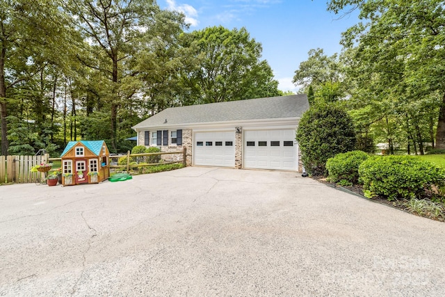 120 Labans Ln, Lincolnton, NC 28092 - view of front of home featuring driveway, a garage, and view of wooded area
