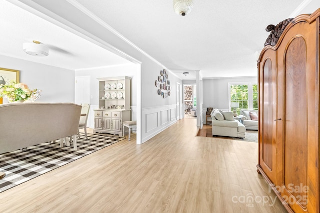 120 Labans Ln, Lincolnton, NC 28092 - hall with light wood-style flooring, ornamental molding, wainscoting, and a decorative wall