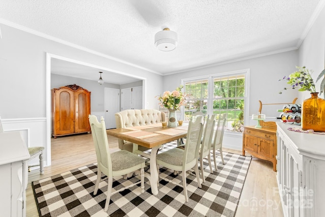 120 Labans Ln, Lincolnton, NC 28092 - dining area featuring a textured ceiling, light wood-style floors, and ornamental molding
