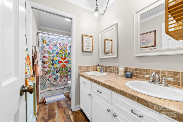 120 Labans Ln, Lincolnton, NC 28092 - full bath with double vanity, ornamental molding, toilet, tasteful backsplash, and wood finished floors