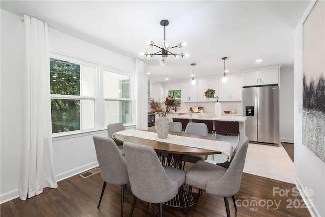 4017 Sulkirk Rd, Charlotte, NC 28210 - dining space with a chandelier, baseboards, recessed lighting, and dark wood-style flooring