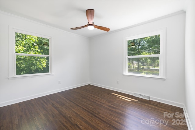 4017 Sulkirk Rd, Charlotte, NC 28210 - empty room with plenty of natural light, dark wood finished floors, ornamental molding, and baseboards