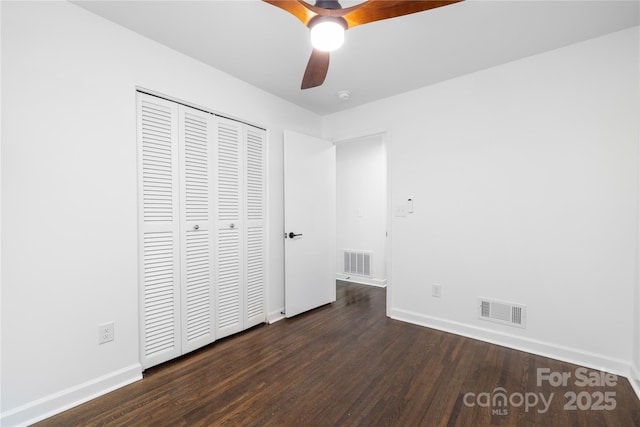 4017 Sulkirk Rd, Charlotte, NC 28210 - unfurnished bedroom with baseboards, dark wood finished floors, and a closet