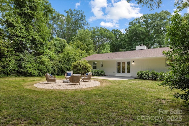 4017 Sulkirk Rd, Charlotte, NC 28210 - back of house featuring a yard, a chimney, a patio, and french doors