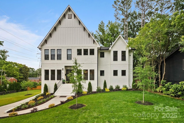 621 Poindexter Dr, Charlotte, NC 28209 - view of front of property with board and batten siding and a front lawn