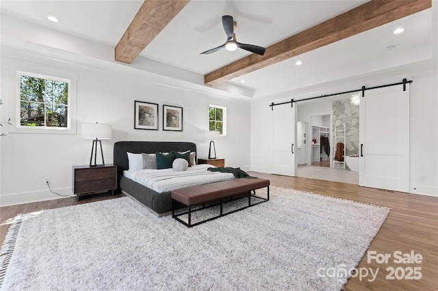 621 Poindexter Dr, Charlotte, NC 28209 - bedroom featuring a barn door, wood finished floors, beamed ceiling, recessed lighting, and baseboards