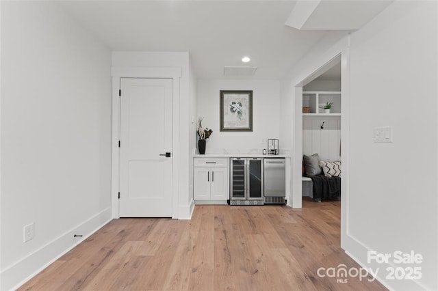 621 Poindexter Dr, Charlotte, NC 28209 - indoor dry bar featuring beverage cooler, light wood-type flooring, baseboards, recessed lighting, and fridge