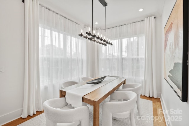 621 Poindexter Dr, Charlotte, NC 28209 - dining room featuring a chandelier, light wood finished floors, baseboards, and recessed lighting