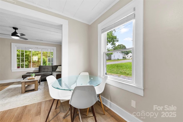 403 W 2nd St, Cherryville, NC 28021 - dining space with wood finished floors, baseboards, and crown molding