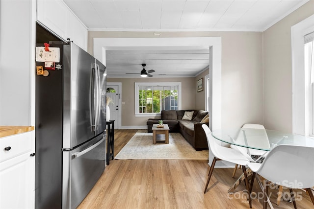 403 W 2nd St, Cherryville, NC 28021 - living area featuring crown molding, light wood finished floors, a ceiling fan, and baseboards