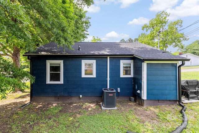 403 W 2nd St, Cherryville, NC 28021 - back of house featuring central AC unit and roof with shingles