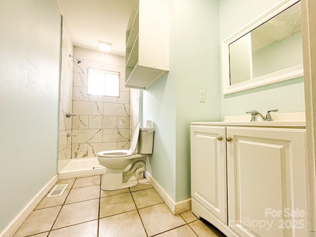 102 Lake Dr, Hickory, NC 28601 - bathroom with toilet, tiled shower, baseboards, vanity, and tile patterned floors