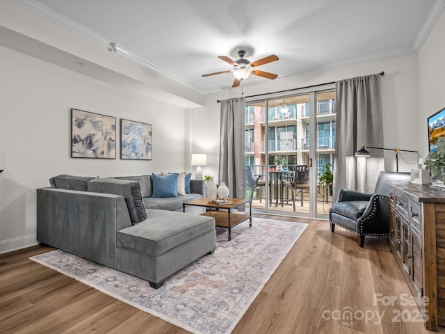 300 W 5th St Unit 433, Charlotte, NC 28202 - living area featuring a ceiling fan, wood finished floors, ornamental molding, and baseboards