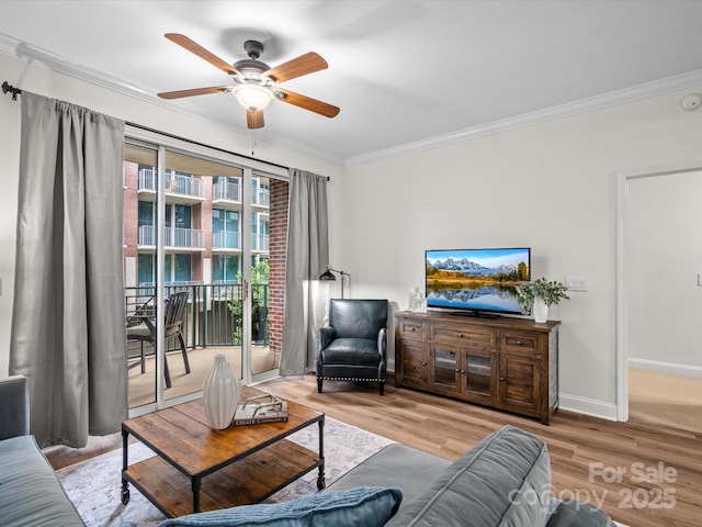 300 W 5th St Unit 433, Charlotte, NC 28202 - living room with crown molding, ceiling fan, wood finished floors, and baseboards