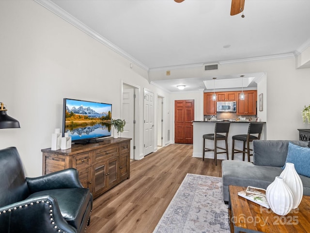 300 W 5th St Unit 433, Charlotte, NC 28202 - living area with ornamental molding, light wood-type flooring, a ceiling fan, and baseboards