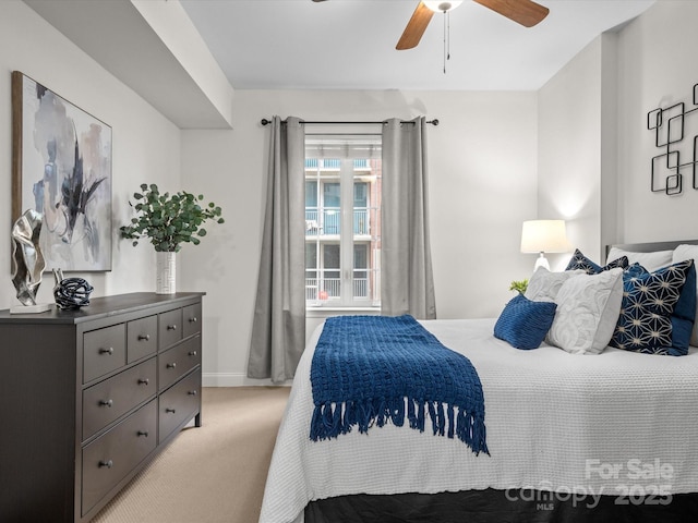 300 W 5th St Unit 433, Charlotte, NC 28202 - bedroom featuring light colored carpet, baseboards, and a ceiling fan