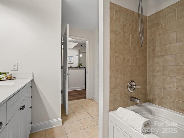 300 W 5th St Unit 433, Charlotte, NC 28202 - bathroom with tile patterned flooring, baseboards, vanity, and shower / washtub combination