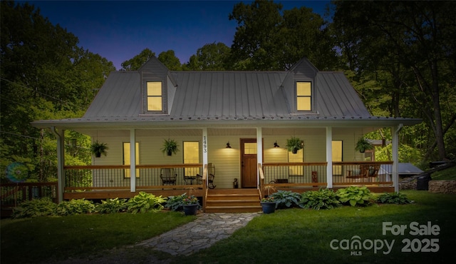 1493 Upper Browns Creek Rd, Burnsville, NC 28714 - country-style home with covered porch, a front yard, and metal roof