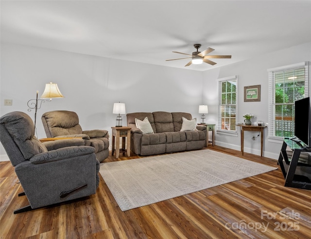 1493 Upper Browns Creek Rd, Burnsville, NC 28714 - living room with ceiling fan, wood finished floors, and baseboards