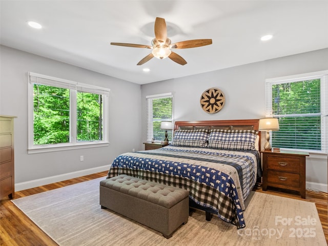 1493 Upper Browns Creek Rd, Burnsville, NC 28714 - bedroom with wood finished floors, baseboards, a ceiling fan, and recessed lighting