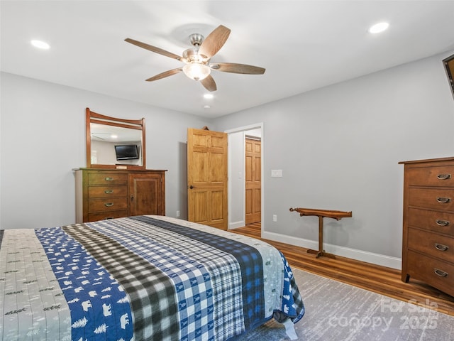 1493 Upper Browns Creek Rd, Burnsville, NC 28714 - bedroom with wood finished floors, recessed lighting, ceiling fan, and baseboards