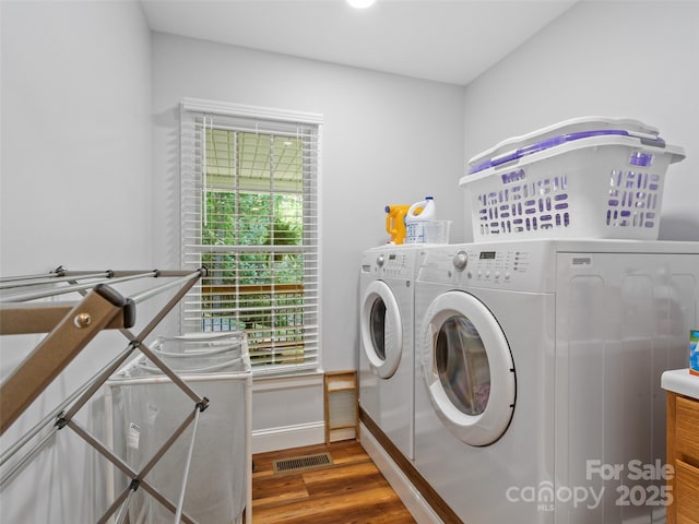 1493 Upper Browns Creek Rd, Burnsville, NC 28714 - laundry area with washing machine and clothes dryer, wood finished floors, and baseboards