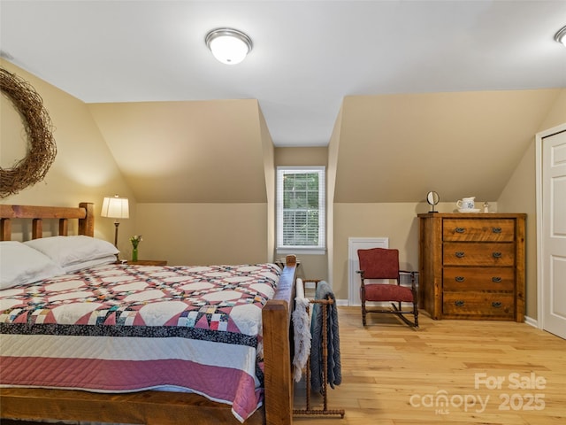 1493 Upper Browns Creek Rd, Burnsville, NC 28714 - bedroom featuring wood finished floors and vaulted ceiling