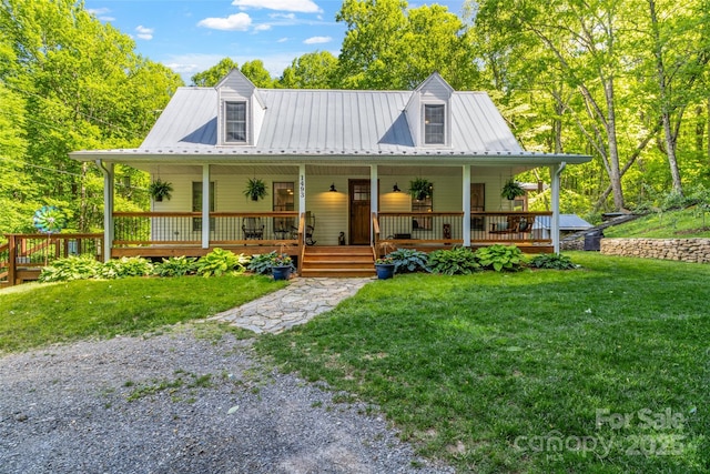 1493 Upper Browns Creek Rd, Burnsville, NC 28714 - farmhouse inspired home featuring metal roof, a front lawn, and a porch