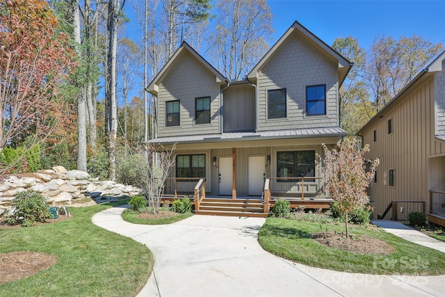 1081 Hicks Rd Unit B, Highlands, NC 28741 - view of front of home with covered porch, board and batten siding, metal roof, and a standing seam roof