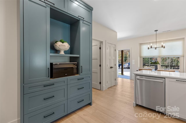 1081 Hicks Rd Unit B, Highlands, NC 28741 - kitchen with dishwasher, light wood-style flooring, light countertops, pendant lighting, and a chandelier