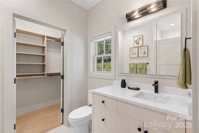 1081 Hicks Rd Unit B, Highlands, NC 28741 - bathroom featuring vanity, wood finished floors, toilet, and baseboards