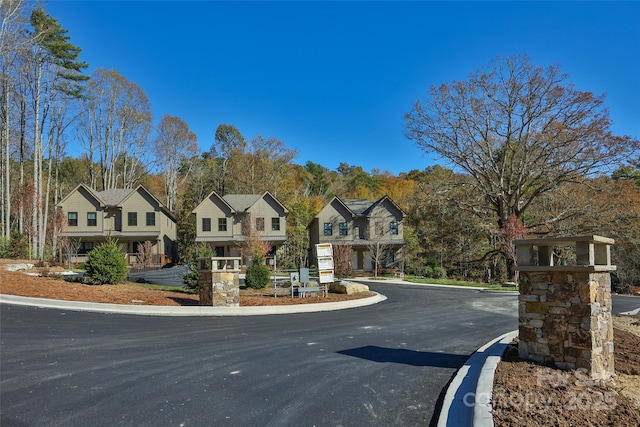 1081 Hicks Rd Unit B, Highlands, NC 28741 - view of asphalt street with curbs, a residential view, and view of scattered trees