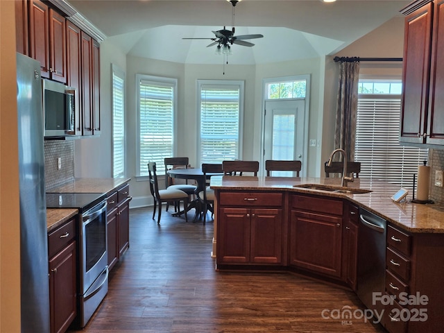 1108 Tarram Ct Unit 12, Lancaster, SC 29720 - kitchen with appliances with stainless steel finishes, a sink, lofted ceiling, ceiling fan, and tasteful backsplash