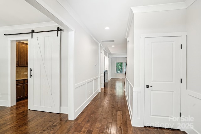 8521 Aspen Ct, Charlotte, NC 28227 - hallway with dark wood-style flooring, a barn door, recessed lighting, and ornamental molding