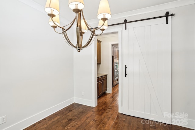 8521 Aspen Ct, Charlotte, NC 28227 - unfurnished room featuring a barn door, dark wood-style flooring, and baseboards