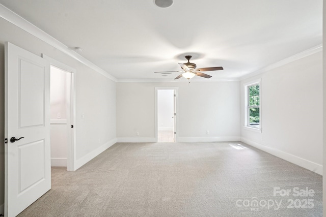 8521 Aspen Ct, Charlotte, NC 28227 - spare room featuring crown molding, light carpet, ceiling fan, and baseboards