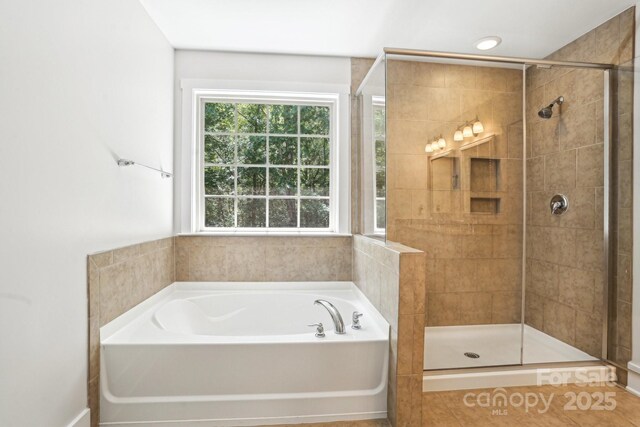 8521 Aspen Ct, Charlotte, NC 28227 - bathroom with a bath and a shower stall