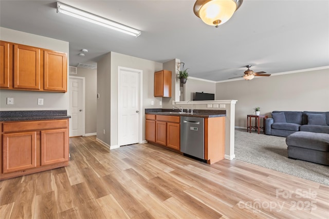 3996 Heather View Ln, Winston Salem, NC 27127 - kitchen featuring stainless steel dishwasher, open floor plan, a peninsula, dark countertops, and ceiling fan