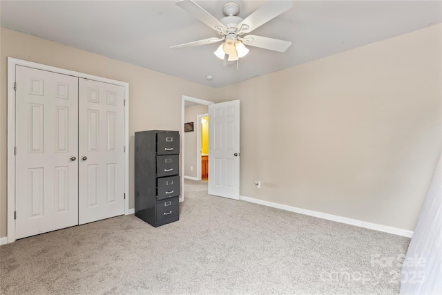 3996 Heather View Ln, Winston Salem, NC 27127 - unfurnished bedroom featuring carpet, baseboards, a closet, and a ceiling fan
