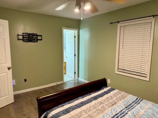 667 Blossom Hill Rd, Lincolnton, NC 28092 - bedroom with wood finished floors, baseboards, and ceiling fan