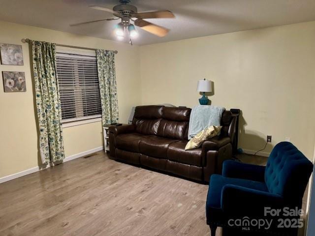 667 Blossom Hill Rd, Lincolnton, NC 28092 - living area with a ceiling fan, wood finished floors, and baseboards